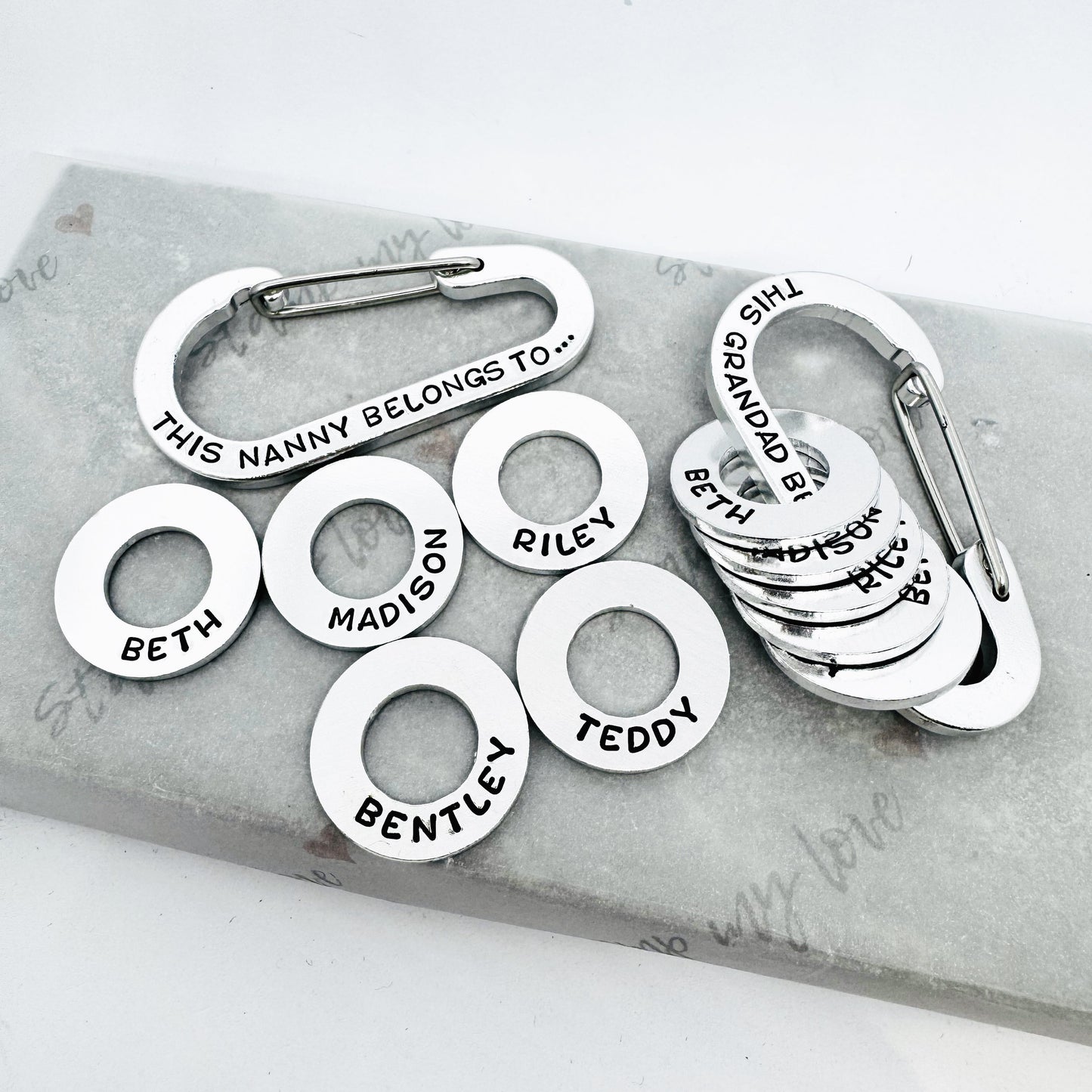 personalised hand stamped carabiner keyring with custom name discs